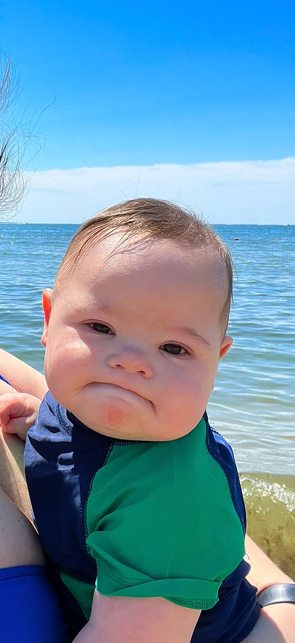 Santino is registered to the contest to win money with this photo: azure, baby, baby_toddler_clothing, blue, cheek, chin, cloud, eye, fun, hairstyle, happy, iris, lake, leisure, nose, person, skin, sky, smile, toddler