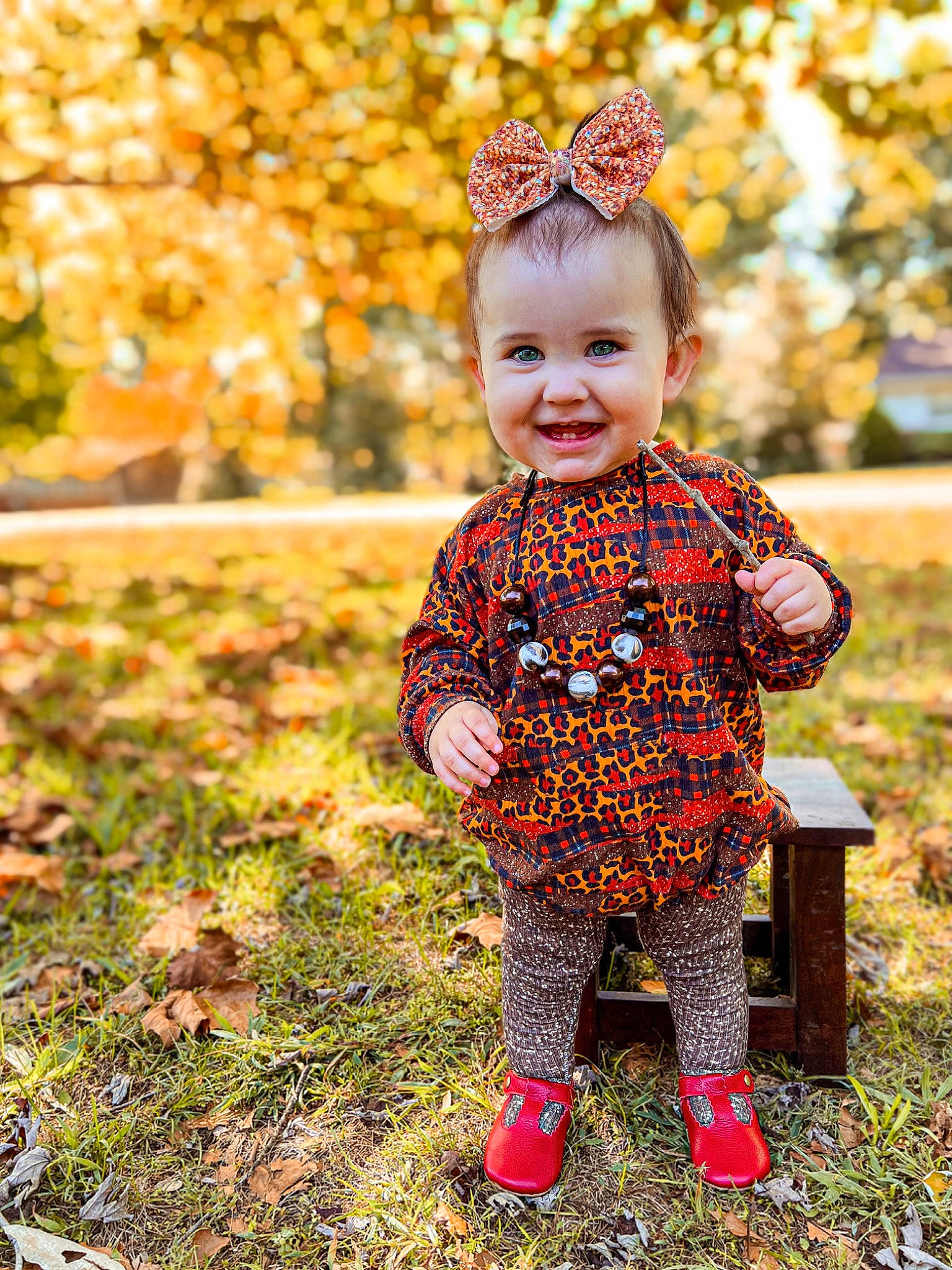 Juliette is registered to the contest to win money with this photo: baby, baby_toddler_clothing, child, deciduous, eye, face, fashion_accessory, fun, grass, happy, head, joy, pattern, people_in_nature, person, plant, sitting, smile, standing, sunlight
