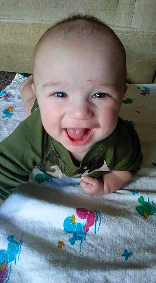 Rylee is registered to the contest to win money with this photo: baby, cheek, child, face, facial_expression, head, joy, lip, mouth, nose, person, play, skin, smile, toddler, tummy_time