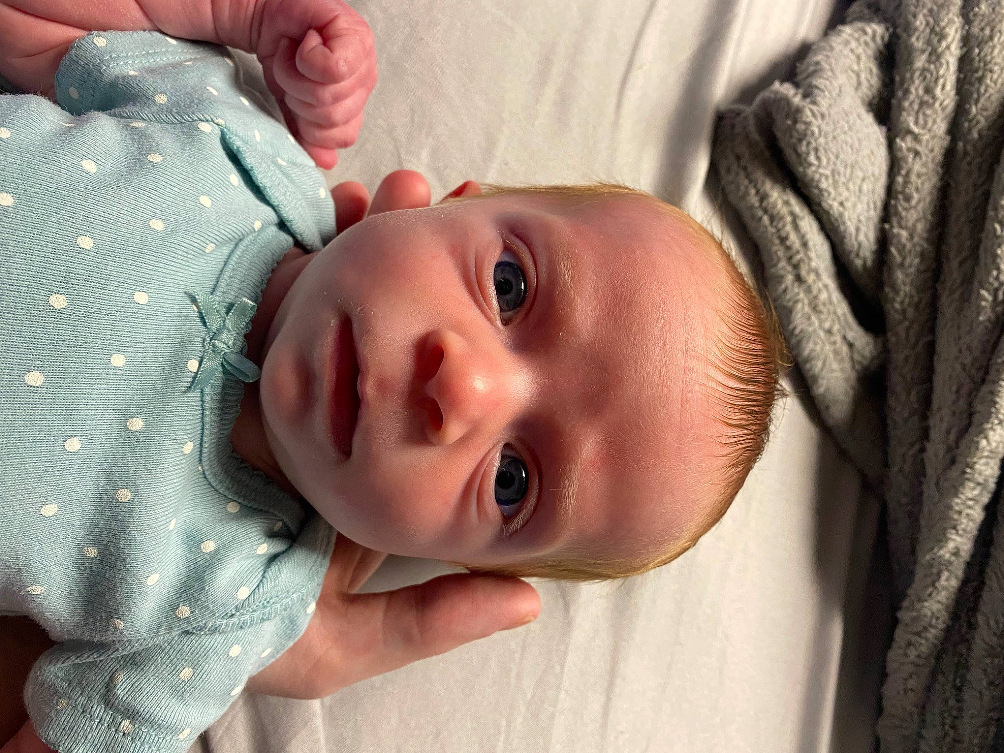 Nova is registered to the contest to win money with this photo: baby, baby_toddler_clothing, cheek, comfort, eye, eyebrow, eyelash, face, hand, happy, head, iris, lip, mouth, neck, nose, person, product, skin, sleeve