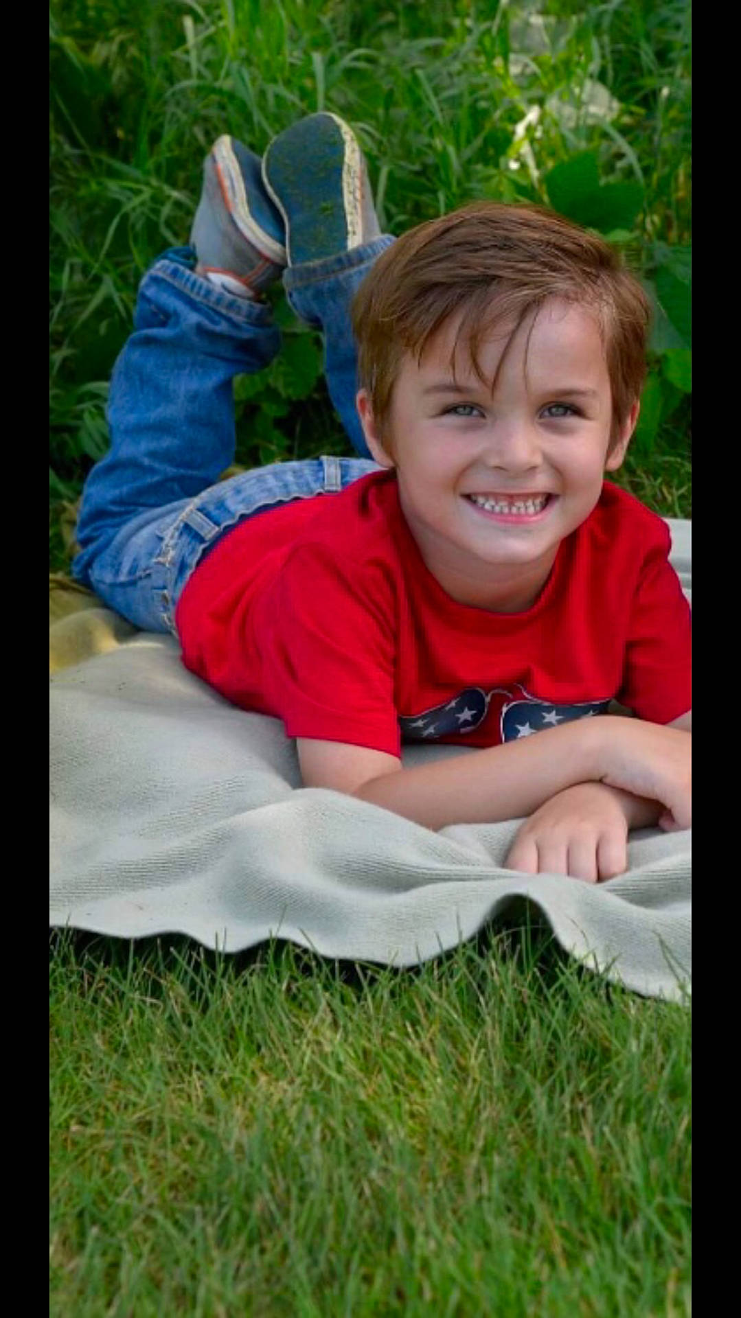 Derrick Taylor is registered to the contest to win money with this photo: boy, child, day, emotion, eye, face, facial_expression, fun, grass, green, joy, lawn, male, nature, person, photograph, plant, sitting, smile, toddler