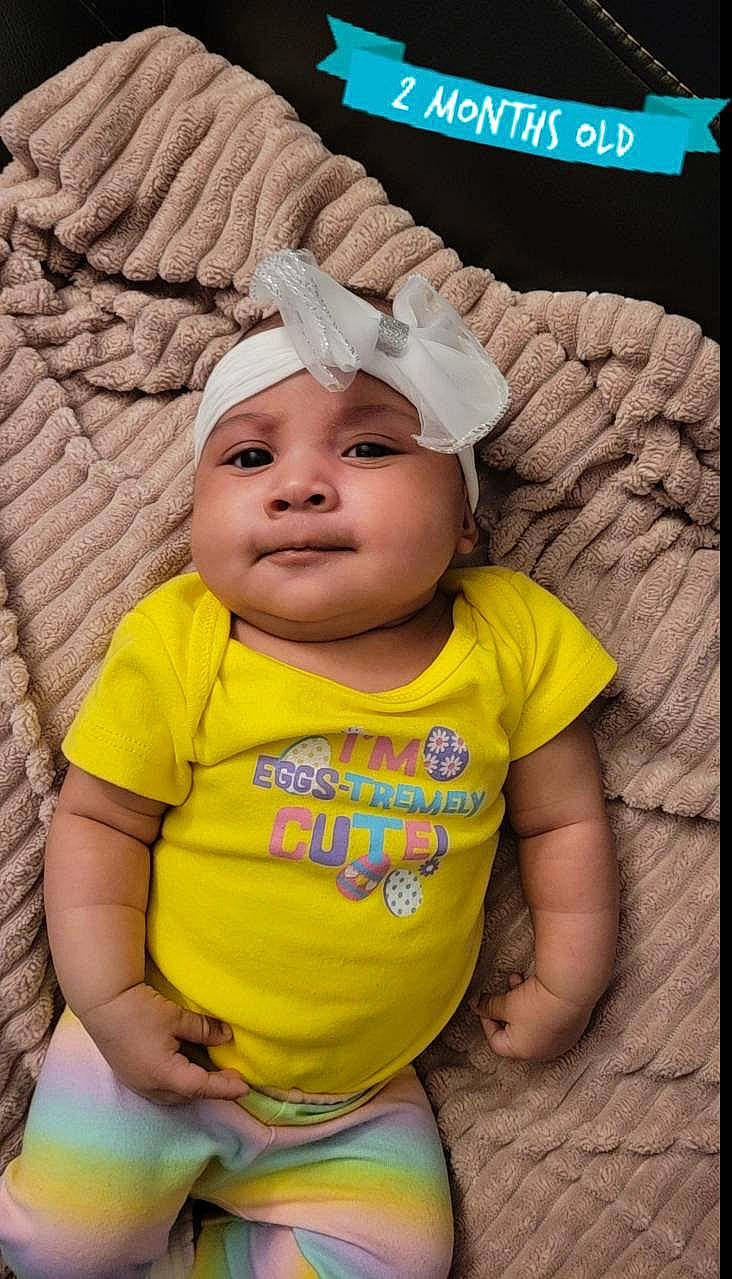 Brooklynn joined the competition — help win amazing prizes! baby, baby_toddler_clothing, beanie, cap, cheek, child, clothing, eye, fashion_accessory, fun, grass, happy, headwear, knit_cap, nose, person, sitting, skin, sleeve, smile