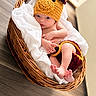 Rowyn joined the competition — help win amazing prizes! baby, newborn, child, portrait, basket, wicker, blanket, white_blanket, knitted_hat, bear_hat, costume, infant, blue_eyes, lying_down, sitting, barefoot, toes, indoor, sunlight, cozy