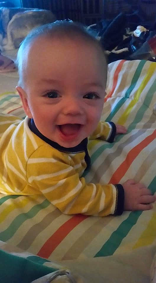 Mark is registered to the contest to win money with this photo: baby, baby_toddler_clothing, cheek, eyebrow, facial_expression, finger, hairstyle, happy, iris, leaf, lip, mammal, mouth, nose, person, product, skin, sleeve, smile, vertebrate