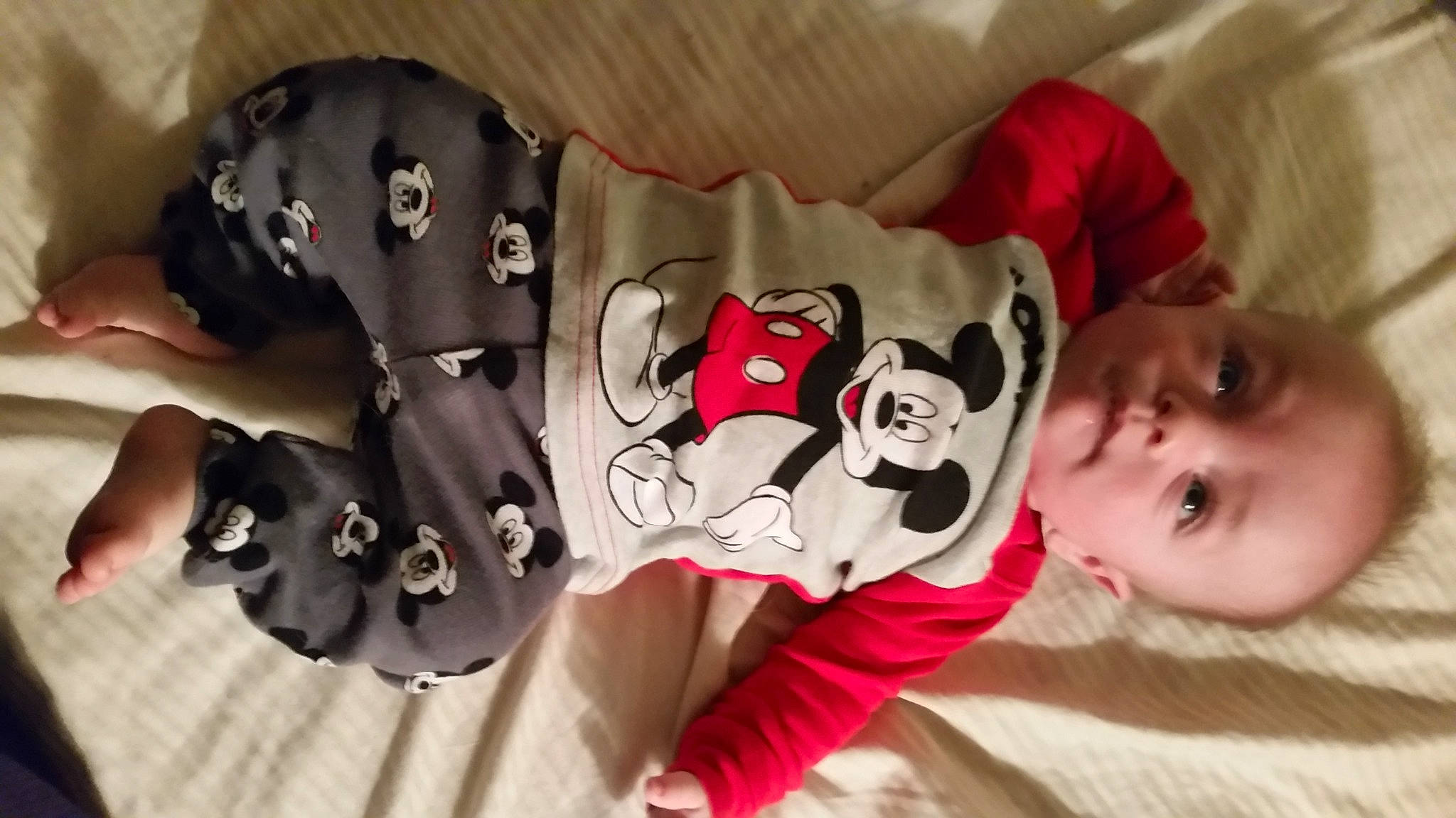 Mark is registered to the contest to win money with this photo: baby, baby_products, baby_toddler_clothing, carmine, cheek, child, comfort, eye, happy, head, linens, mammal, pattern, person, product, room, skin, sleeve, textile, toddler