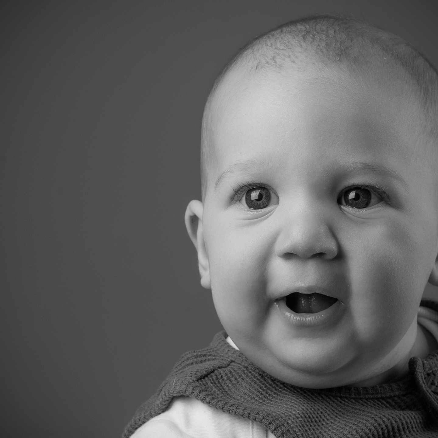 Finn joined the competition — help win amazing prizes! baby, background, black_and_white, child, close_up, curious, cute, expression, eyes, face, head, infant, monochrome, person, portrait, smile, soft_light, studio, sweater, young