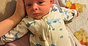 Bolin is registered to the contest to win money with this photo: baby, baby_bottle, blanket, child, comfort, couch, cozy, cute, dinosaur_pajamas, hand, indoor, infant, newborn, parent, person, portrait, relaxing, sleepwear, soft_fabric, winnie_the_pooh