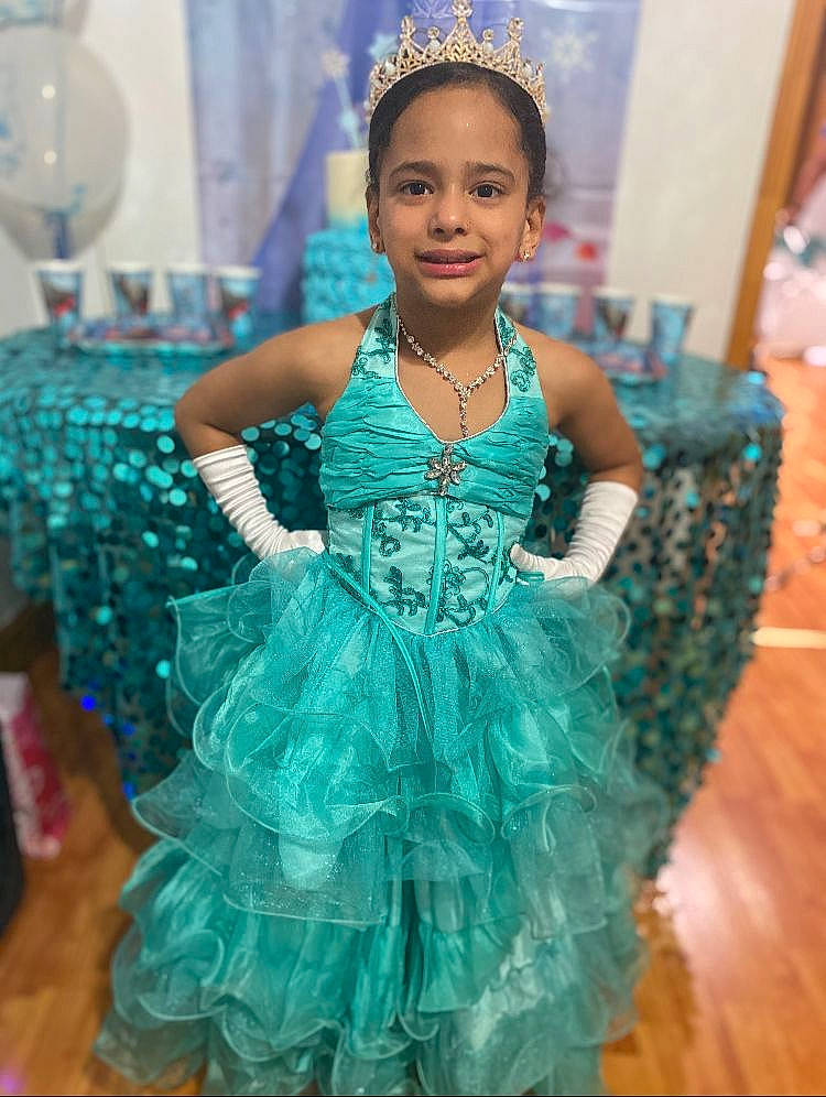 Britney is registered to the contest to win money with this photo: aqua, azure, black_hair, blue, dress, embellishment, entertainment, event, face, fashion, fashion_design, formal_wear, happy, head, headpiece, jewellery, joy, makeover, person, ruffle