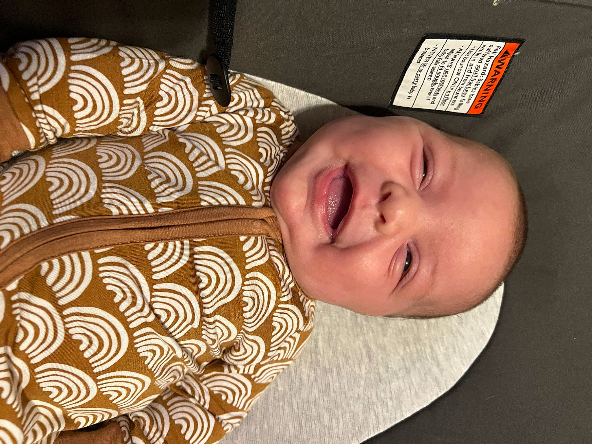 Bradley is registered to the contest to win money with this photo: baby_laughing, baby_toddler_clothing, cheek, child, comfort, couch, eye, eyelash, face, happy, hat, linens, nose, pattern, person, room, skin, sleeve, smile, textile