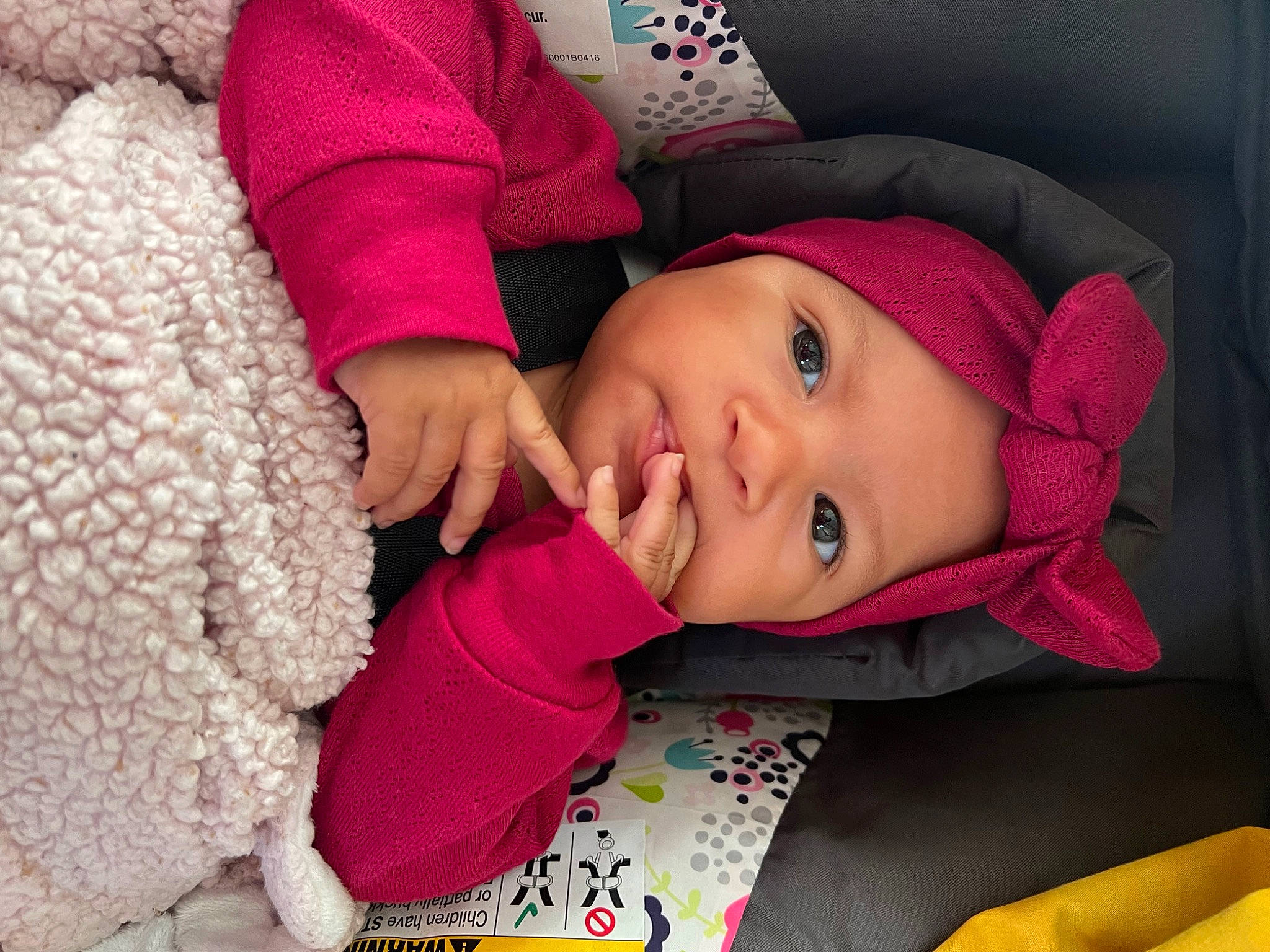 Armani is registered to the contest to win money with this photo: baby, baby_toddler_clothing, cheek, child, clothing, comfort, eye, face, happy, headgear, headwear, lip, mouth, nose, outerwear, person, pink, skin, sleeve, textile