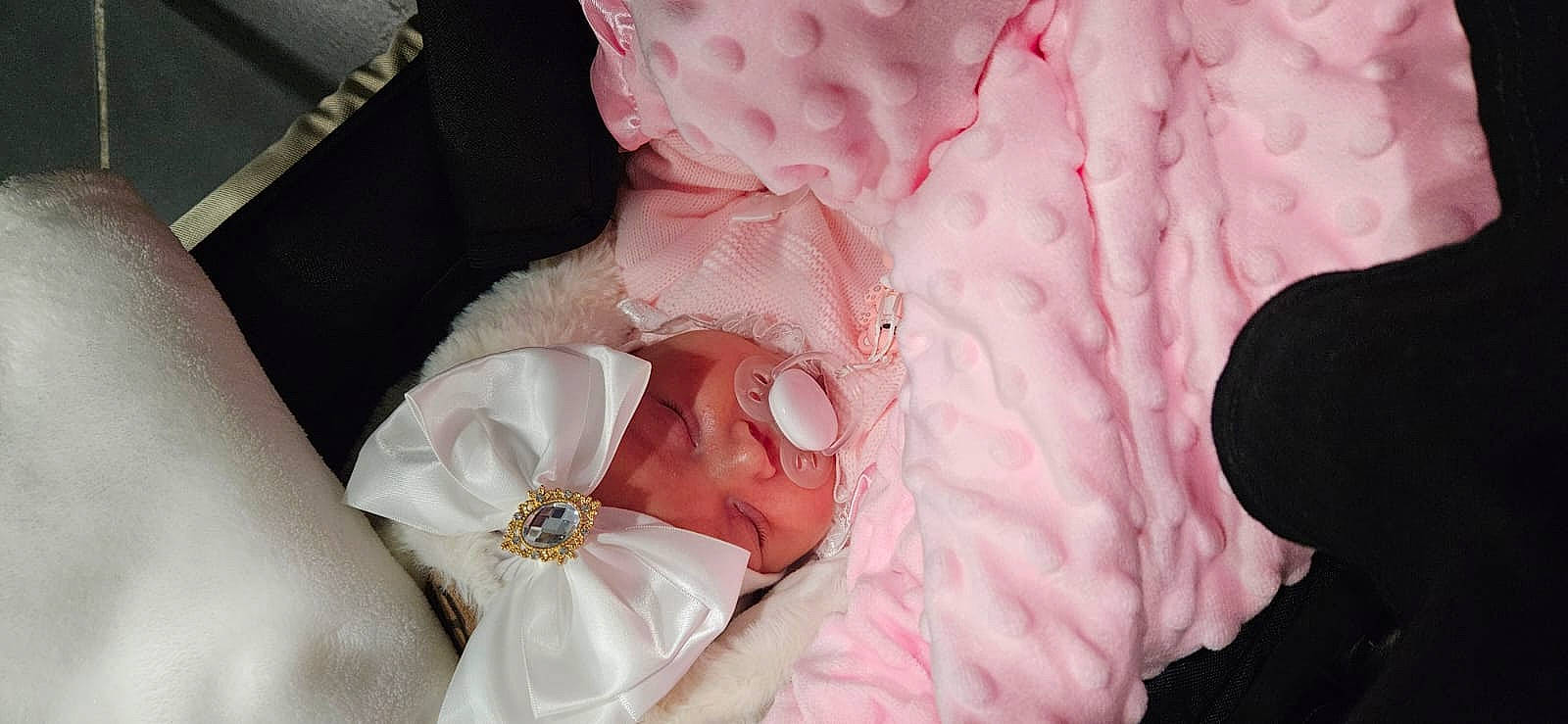 Bethesda participe au concours pour gagner de l'argent avec cette photo : baby, baby_products, baby_sleeping, baby_toddler_clothing, child, comfort, dress, event, fashion_accessory, headgear, linens, magenta, nail, pattern, peach, person, petal, pink, textile, toddler