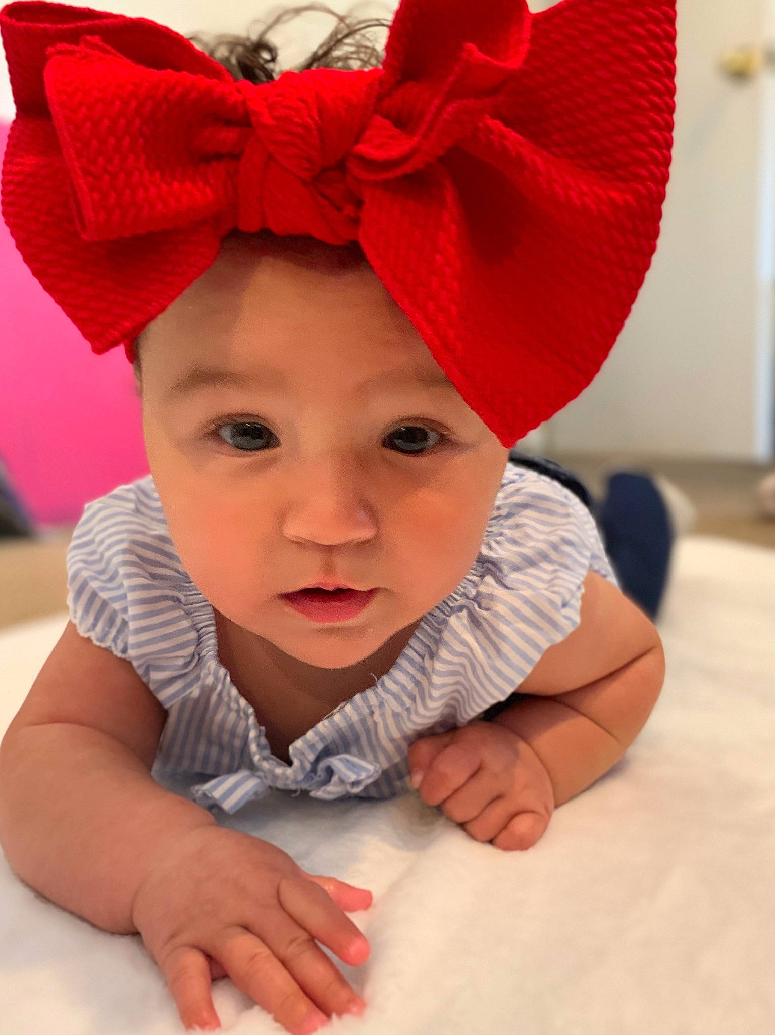 Huntleigh Tanner is registered to the contest to win money with this photo: baby, child, christmas, costume, costume_accessory, ear, fashion_accessory, fictional_character, hat, head, headgear, headwear, organ, person, pink, red, skin, smile, toddler