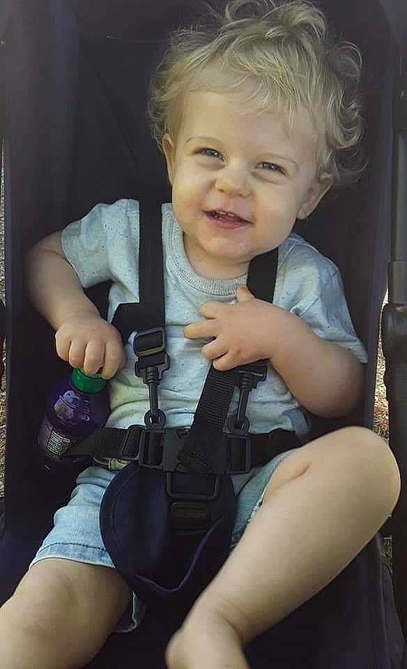 Leon is registered to the contest to win money with this photo: baby_carriage, baby_toddler_clothing, cheek, chin, finger, gesture, happy, human_body, iris, joint, leg, lip, mouth, muscle, person, seat_belt, skin, smile, thumb, toddler