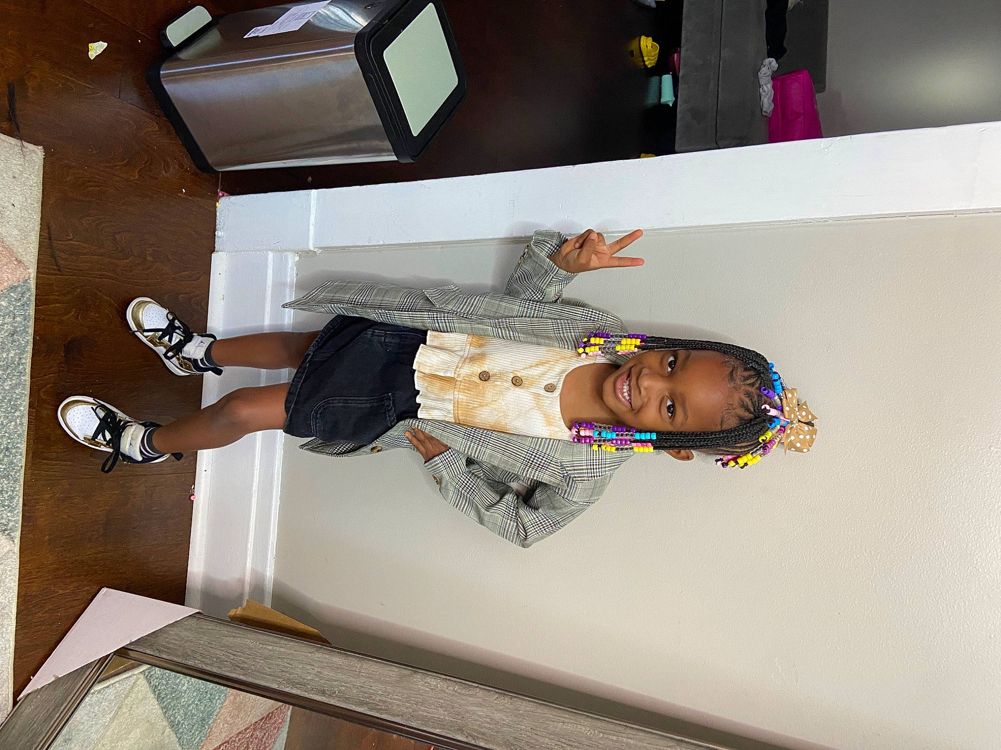 Amora is registered to the contest to win money with this photo: building, comfort, elbow, fashion_design, flooring, fun, hardwood, human_leg, joy, knee, person, room, t_shirt, thigh, walking_shoe, wood, wrist