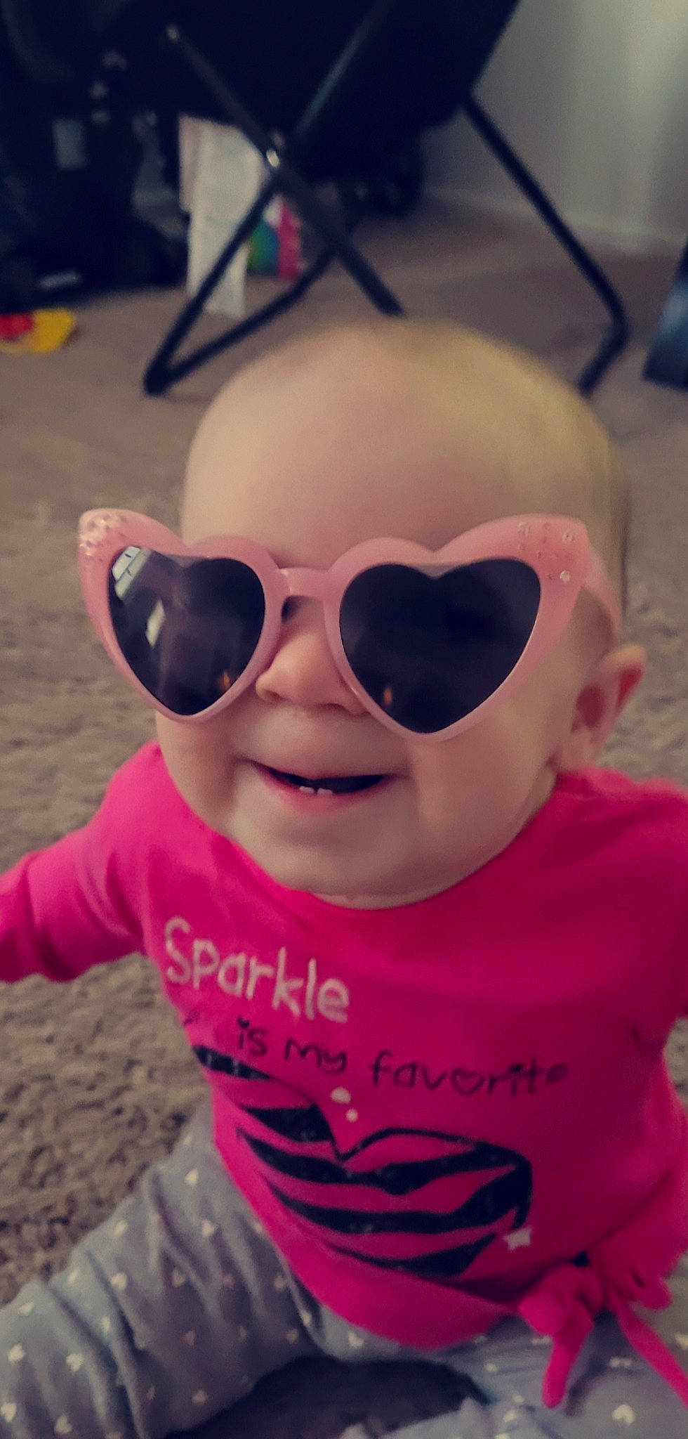 Madelyn is registered to the contest to win money with this photo: baby_toddler_clothing, cheek, cool, eyebrow, eyewear, fun, glasses, goggles, happy, mammal, mouth, nose, person, pink, sleeve, smile, sunglasses, t_shirt, toddler, vision_care