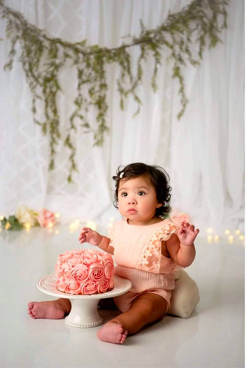Jazzlynn is registered to the contest to win money with this photo: baby, child, curtain, flash_photography, flooring, hand, happy, human_leg, magenta, peach, person, petal, pink, plant, room, sitting, skin, sweetness, tableware, textile