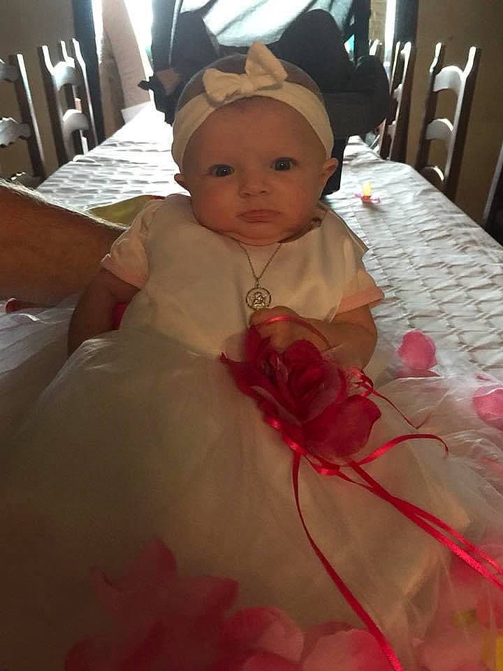 Lindsay participe au concours pour gagner de l'argent avec cette photo : baby, baby_toddler_clothing, chair, child, comfort, event, flooring, fun, hair_accessory, happy, headpiece, linens, magenta, peach, person, petal, pink, skin, textile, toddler