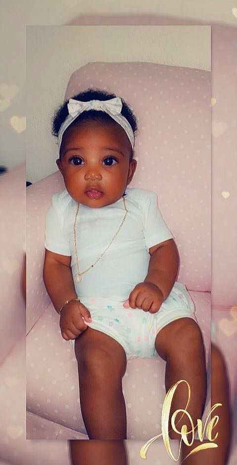 Gianna is registered to the contest to win money with this photo: baby, baby_toddler_clothing, cap, cheek, child, comfort, eye, flash_photography, happy, human_leg, iris, knee, lip, person, pink, sitting, skin, sleeve, thigh, toddler