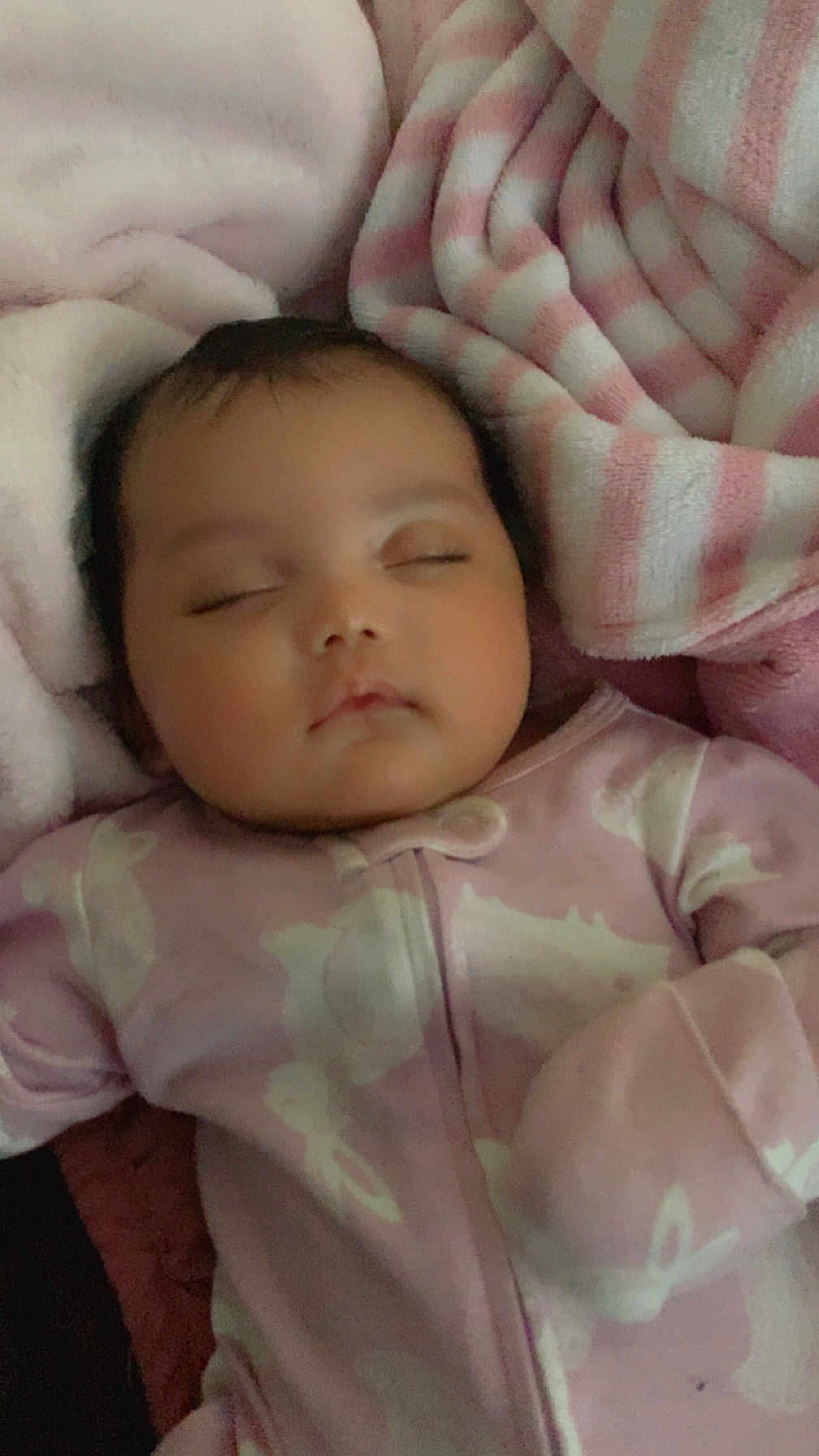 Star is registered to the contest to win money with this photo: baby, sleeping, onesie, pink, blanket, soft, cozy, infant, child, face, peaceful, closed_eyes, cute, young, resting, indoors, warm, comfort, portrait, toddler
