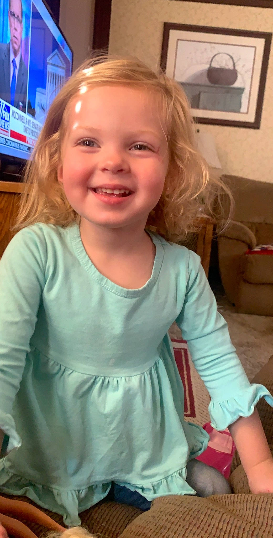 Skyler joined the competition — help win amazing prizes! blond, brown_hair, cheek, child, child_model, face, facial_expression, hair, joy, long_hair, person, sitting, skin, sleeve, smile, toddler, tooth
