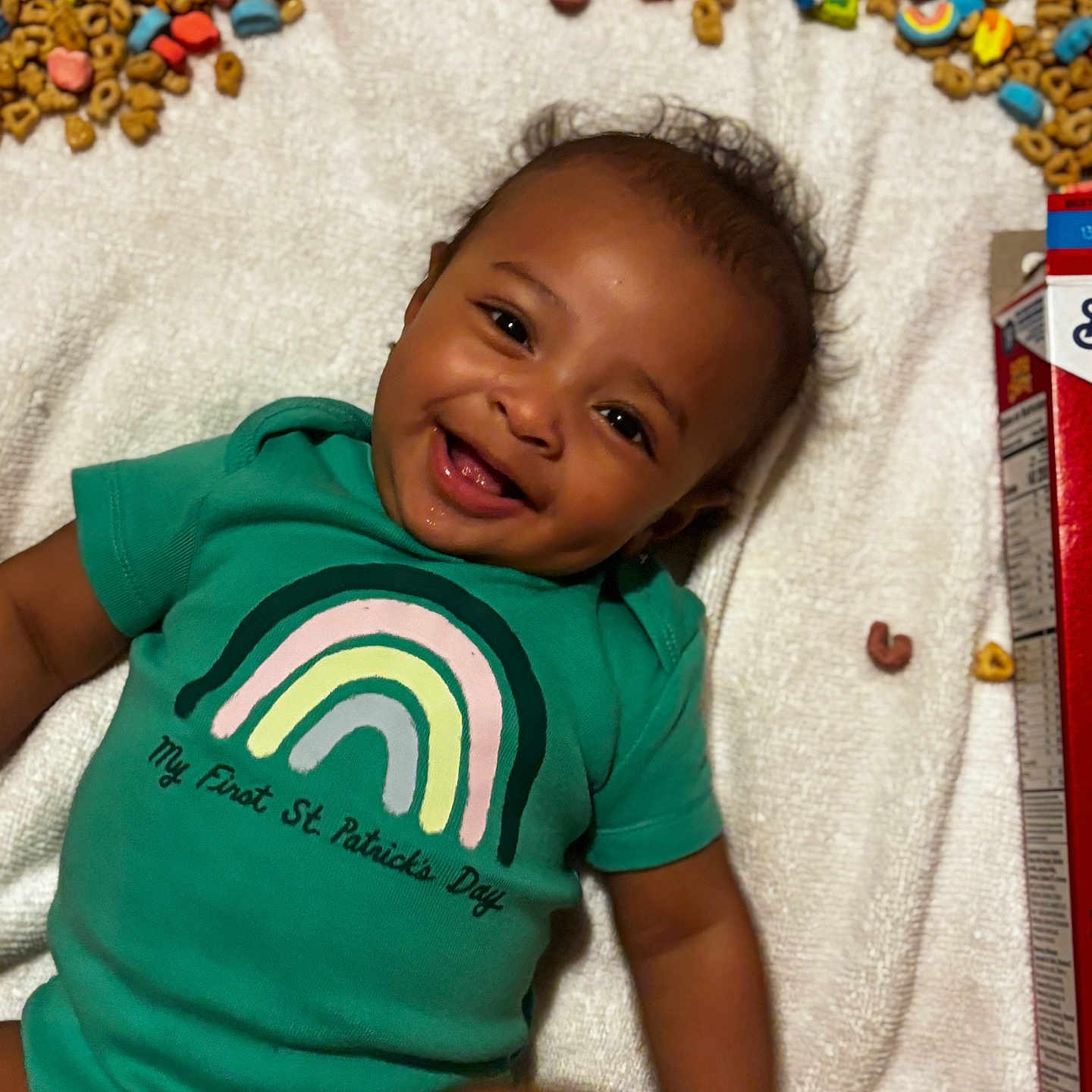 Elijah joined the competition — help win amazing prizes! applique, baby, babylaughing, blanket, bodypart, clothing, face, finger, hand, happy, head, laughing, mouth, pattern, person, photography, portrait, sitting, smile, t_shirt
