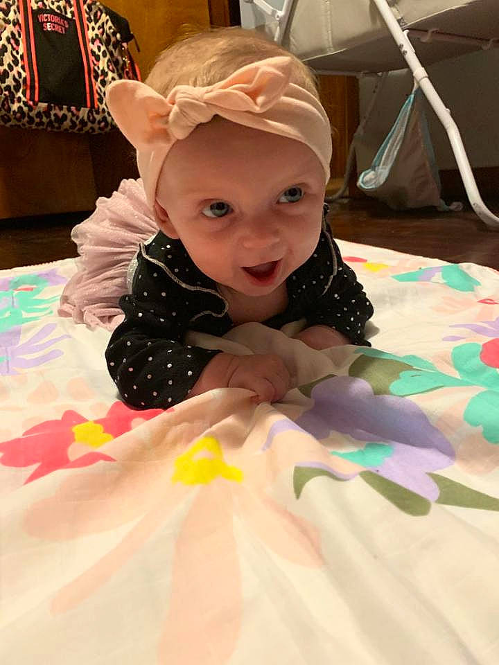 Evelyn is registered to the contest to win money with this photo: baby, child, head, headgear, headwear, person, play, room, skin, toddler