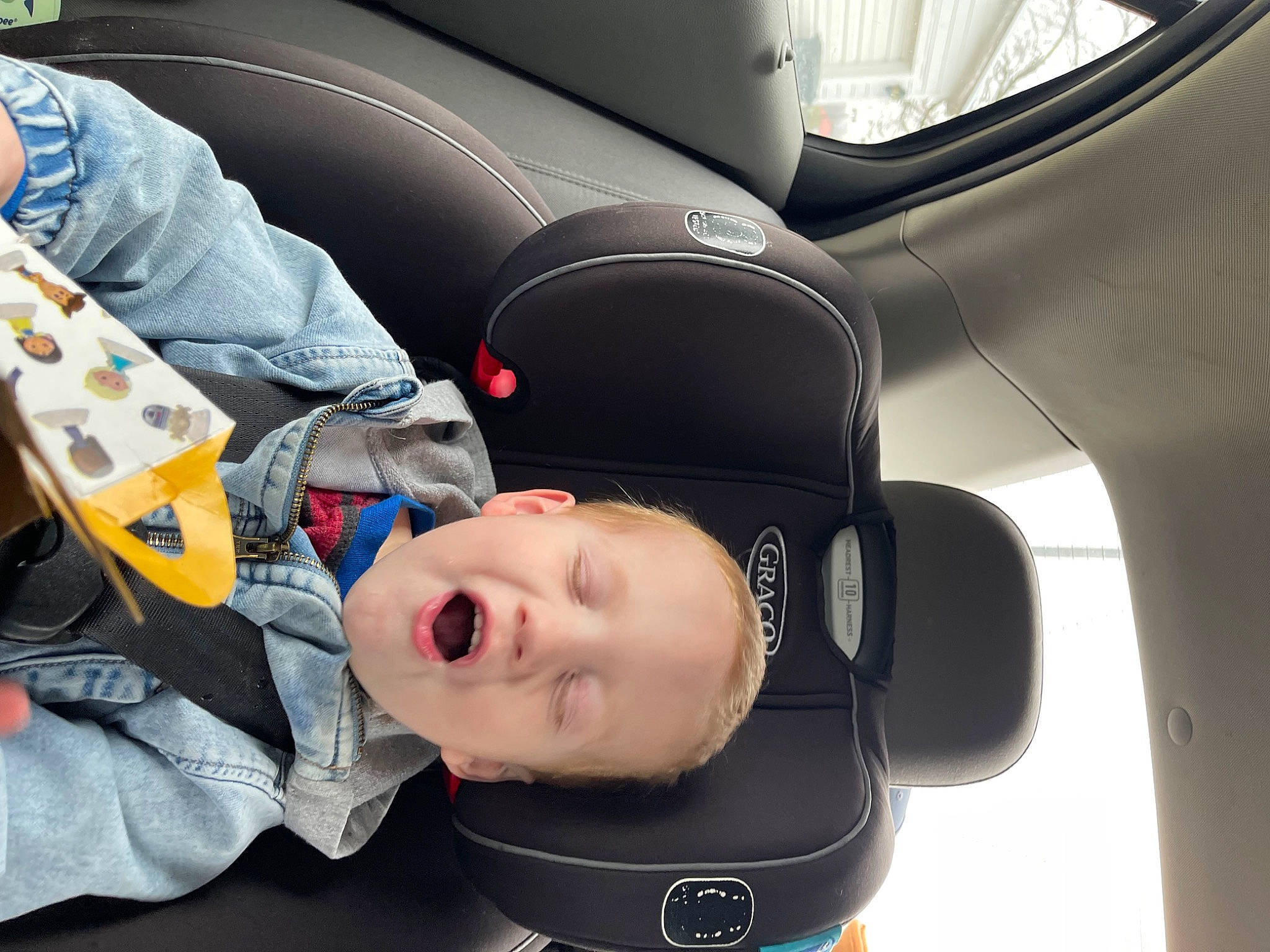 Jayden is registered to the contest to win money with this photo: auto_part, automotive_design, automotive_exterior, baby, car_seat, car_seat_cover, carmine, child, comfort, electric_blue, eyewear, family_car, head_restraint, luxury_vehicle, motor_vehicle, person, personal_luxury_car, personal_protective_equipment, sports_gear, toddler