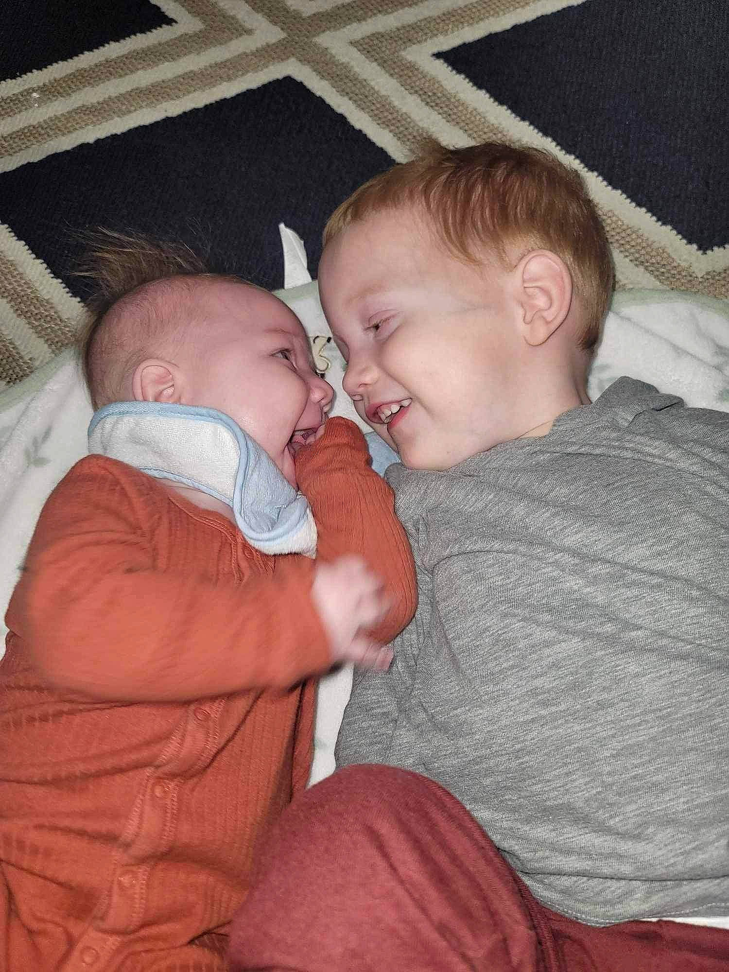 Jayden is registered to the contest to win money with this photo: baby, baby_toddler_clothing, cheek, child, chin, comfort, couch, ear, finger, gesture, happy, head, interaction, iris, joy, mouth, nose, person, skin, smile