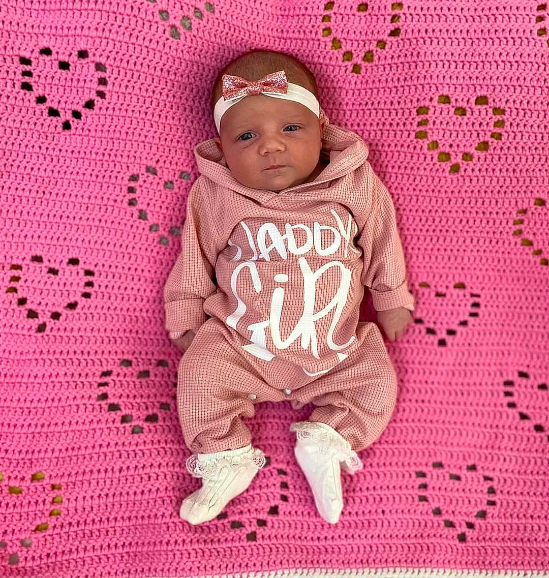 Amelia joined the competition — help win amazing prizes! baby, baby_sleeping, baby_toddler_clothing, cap, cheek, child, comfort, face, font, happy, headwear, hood, linens, magenta, pattern, person, pink, purple, sleeve, t_shirt