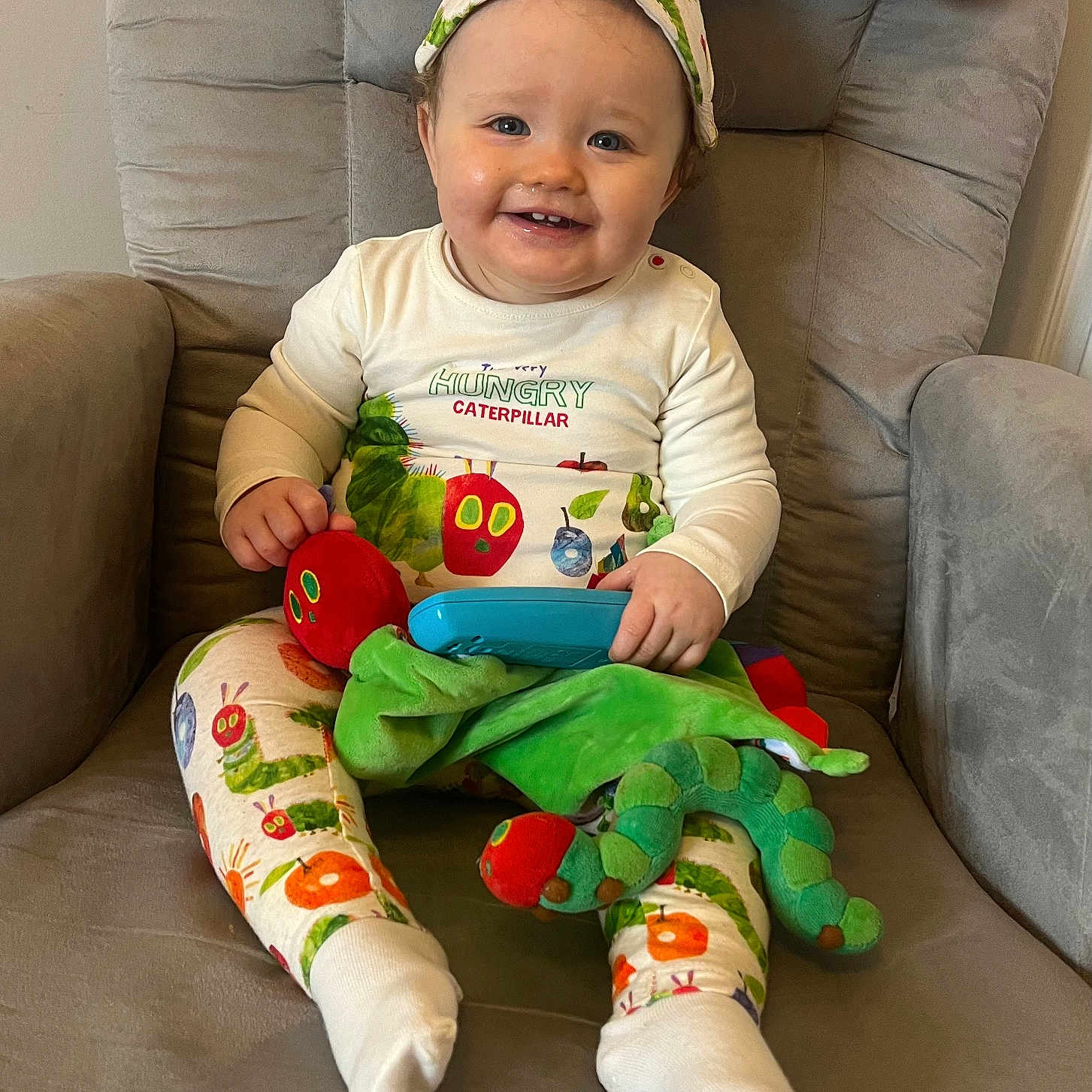 Sienna joined the competition — help win amazing prizes! baby, babylaughing, chair, clothing, couch, cushion, face, furniture, happy, head, homedecor, hosiery, pajamas, pants, person, photography, portrait, sitting, smile, sock