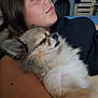 Madison participe au concours pour gagner de l'argent avec cette photo : woman, dog, cuddling, relaxed, indoor, fluffy_dog, casual, portrait, pet, comfort, resting, human, animal, face, fur, closeup, calm, laying_down, skin, black_clothing