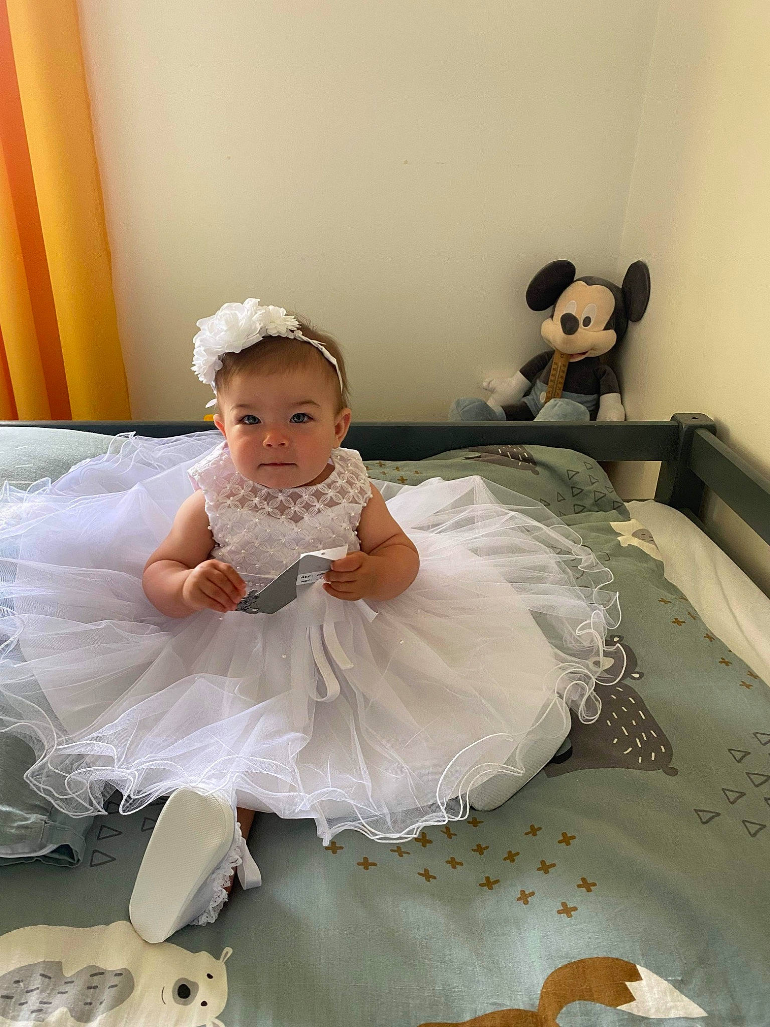 Maëlie participe au concours pour gagner de l'argent avec cette photo : baby, baby_toddler_clothing, bridal_accessory, bridal_clothing, child, comfort, dress, embellishment, event, flash_photography, gown, happy, headpiece, person, pink, room, skin, textile, toddler, toy