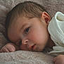baby, infant, face, blanket, soft_texture, sleepy, close_up, child, newborn, skin, eyelashes, hand, cute, lying_down, white_clothing, warm, comfort, portrait, peaceful, resting