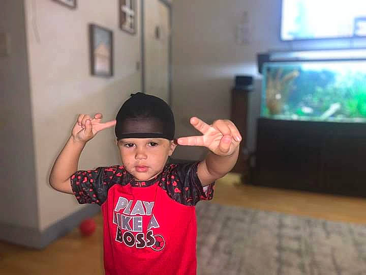 Karson joined the competition — help win amazing prizes! baseball_cap, cap, child, elbow, event, flash_photography, flat_panel_display, flooring, fun, gesture, happy, headwear, human_body, leisure, person, picture_frame, room, sleeve, t_shirt, television_set