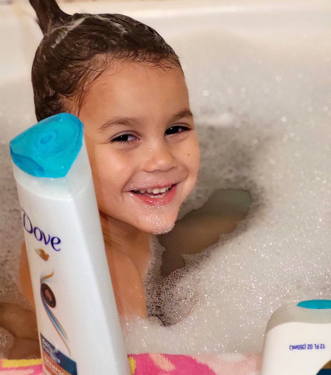 Karson is registered to the contest to win money with this photo: bathing, bathroom, bathtub, eyebrow, fluid, fun, happy, household_supply, joy, leisure, liquid, person, personal_care, plastic, plastic_bottle, plumbing, product, recreation, skin, smile