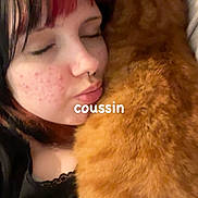 Simba a rejoint le concours — aidez-le/la à gagner de superbes lots ! affection, black_clothing, cat, close_up, closed_eyes, comfort, cozy, cute, face, fur, hair, indoor, nose_ring, orange_cat, person, pet, red_hair_highlight, resting, snuggling, young_adult