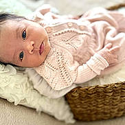 Lila Roslind joined the competition — help win amazing prizes! baby, infant, basket, blanket, knitted_clothing, pink, soft_texture, face, eyes, lying_down, cozy, indoor, portrait, cute, newborn, child, fabric, woven, peaceful, closeup