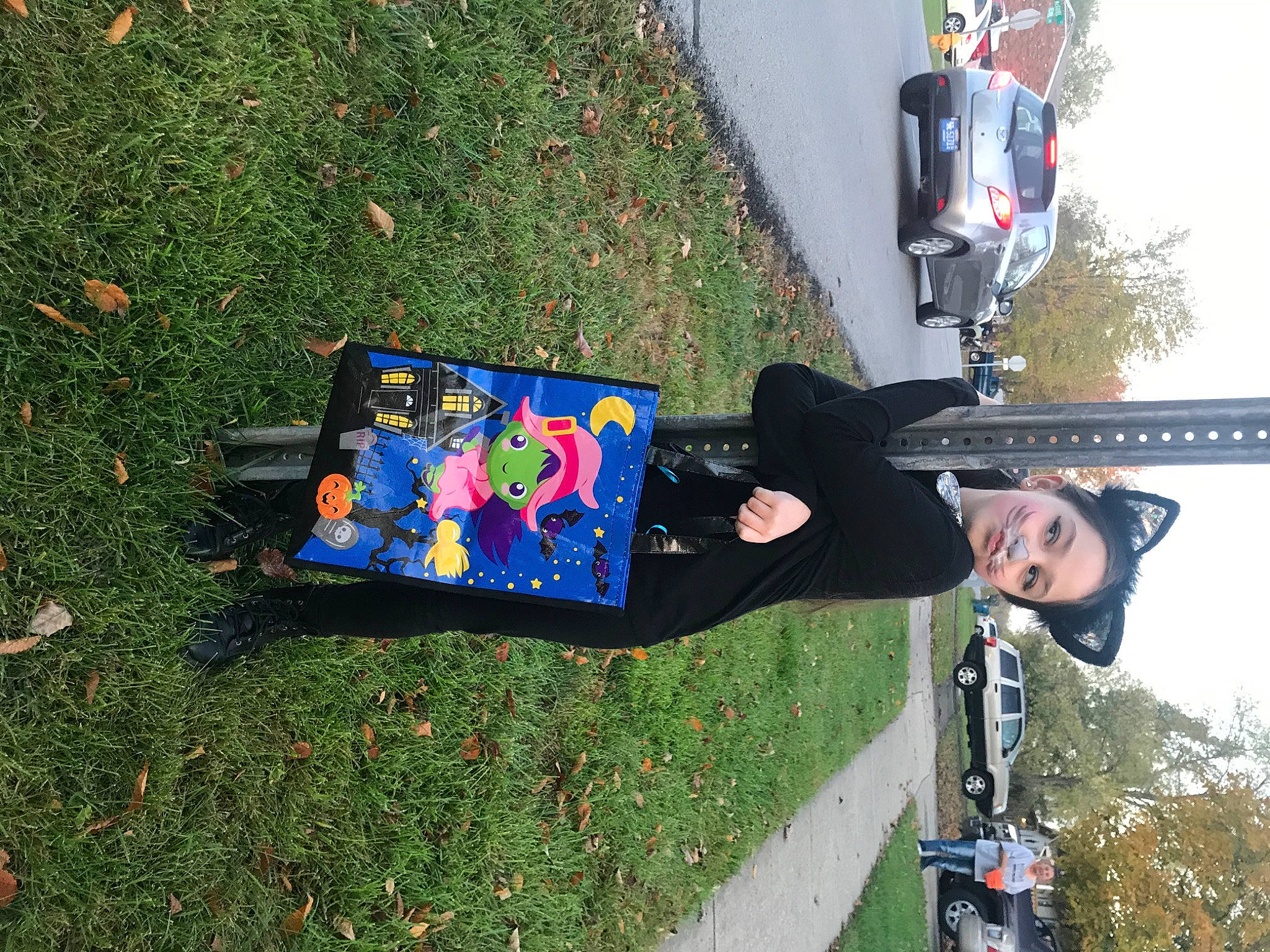 Rosie joined the competition — help win amazing prizes! art, asphalt, automotive_exterior, automotive_tire, car, fun, grass, land_vehicle, leisure, motor_vehicle, person, plant, recreation, sky, smile, tire, travel, tree, vehicle, walking_shoe