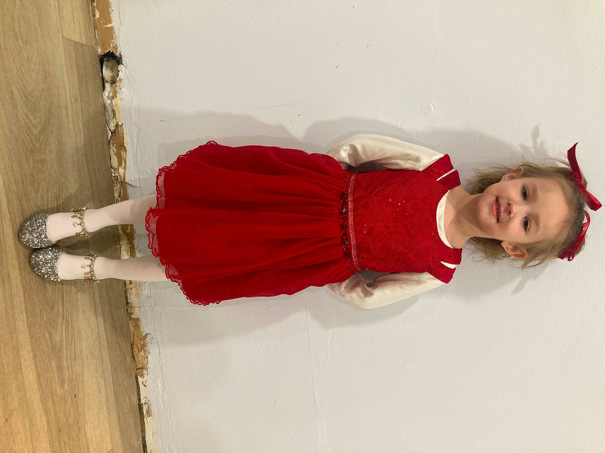 Paislee is registered to the contest to win money with this photo: carmine, cocktail_dress, dress, fashion_design, flooring, footwear, funeral, human_leg, joint, joy, knee, magenta, peach, person, room, sitting, street_fashion, textile, thigh, trunk