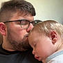 man, child, toddler, sleeping, glasses, beard, kiss, affection, intimacy, closeup, indoor, portrait, love, family, gentle, rest, peaceful, casual_clothing, head, skin
