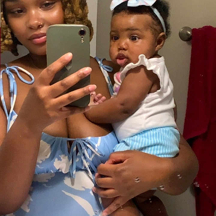 Laiyomi is registered to the contest to win money with this photo: woman, baby, mirror, selfie, bathroom, towel, phone, headband, clothing, person, portrait, holding, reflection, sink, hand, hair, face, smile, cute, indoor