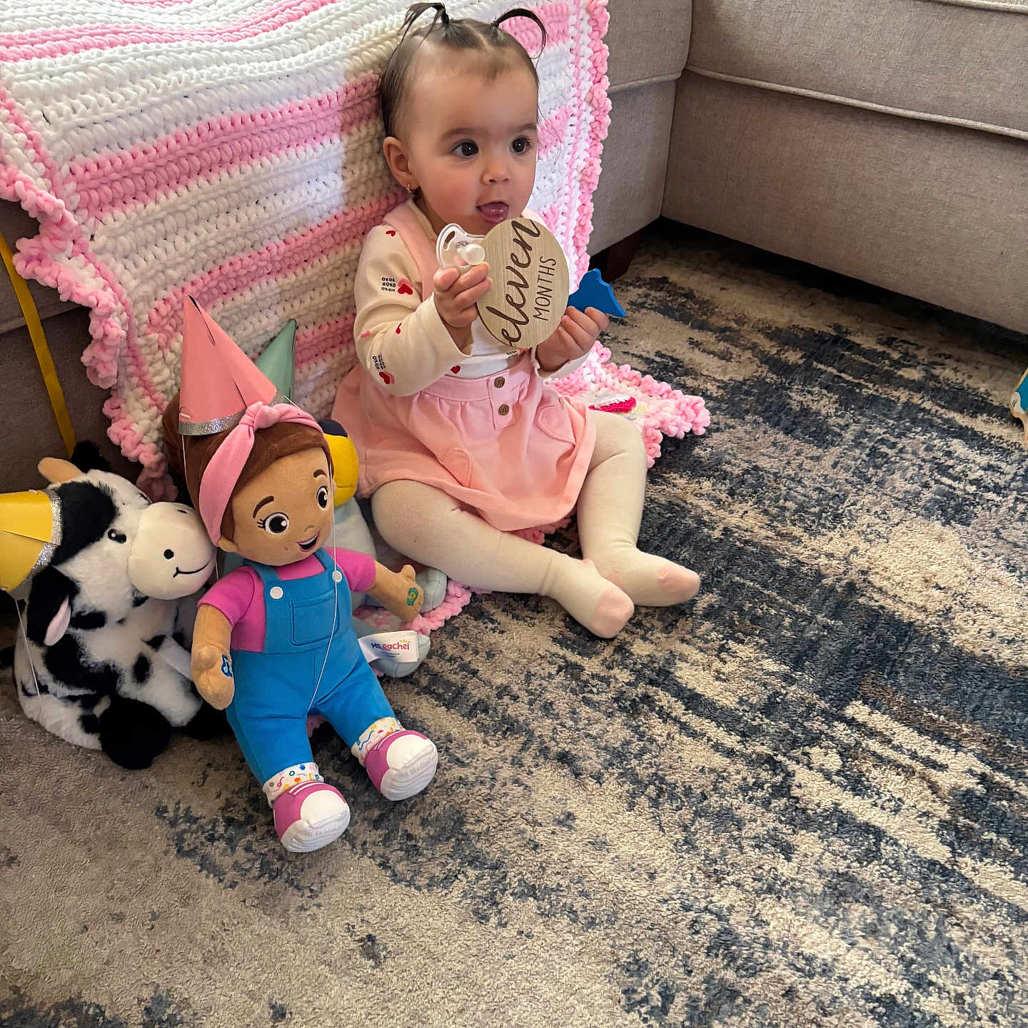 Hawley is registered to the contest to win money with this photo: architecture, baby, building, clothing, couch, cushion, face, footwear, furniture, hat, head, homedecor, indoors, livingroom, person, photography, plush, portrait, room, toy