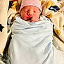 Houston joined the competition — help win amazing prizes! newborn, baby, sleeping, blanket, hat, swaddled, cozy, fleece, pattern, star, soft, infant, cute, resting, indoors, warm, child, person, portrait, peaceful