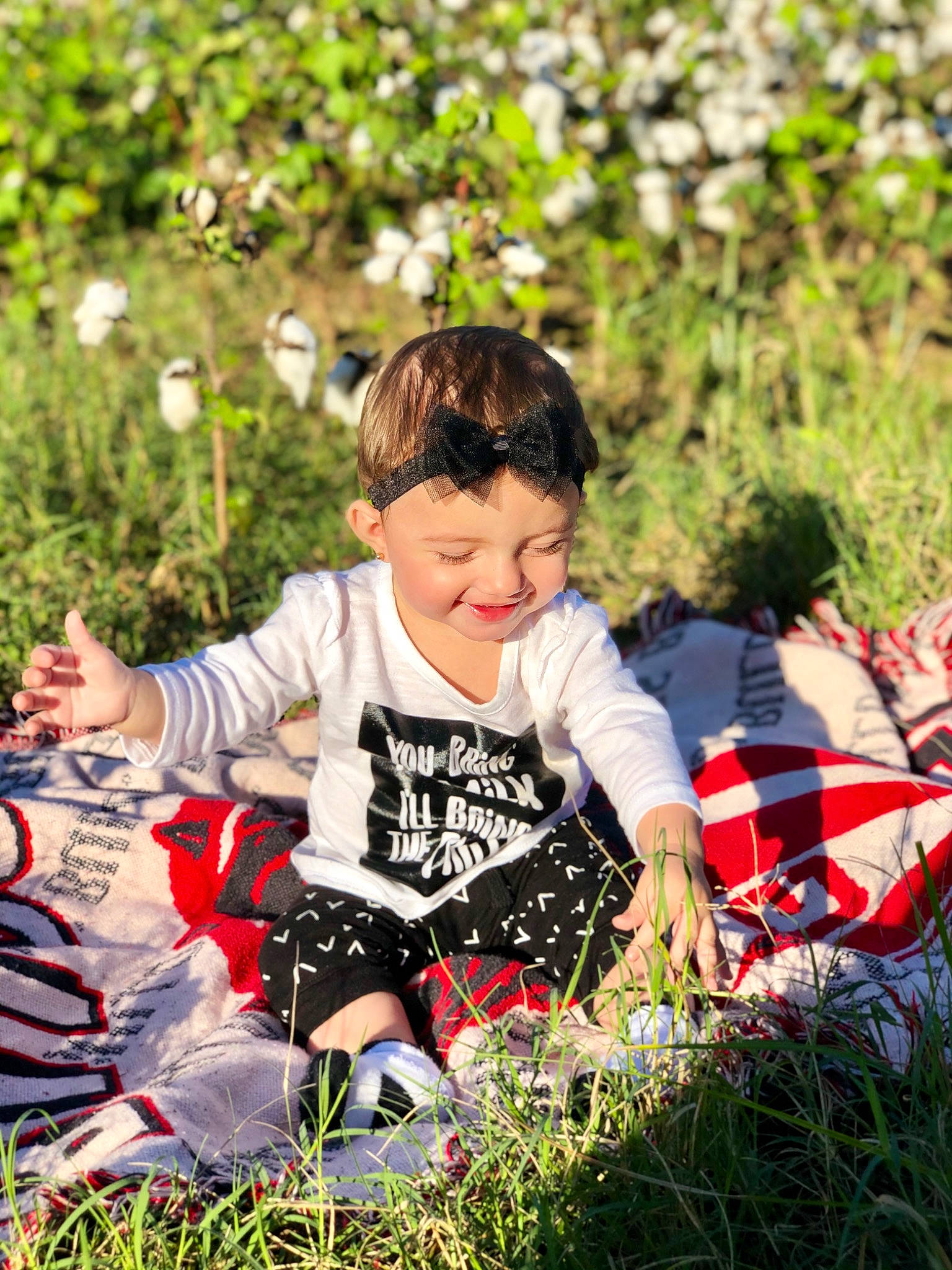 Madalynn is registered to the contest to win money with this photo: child, fun, grass, grass_family, happy, joy, lawn, leisure, male, people_in_nature, person, photography, plant, play, recreation, sitting, spring, toddler, tree