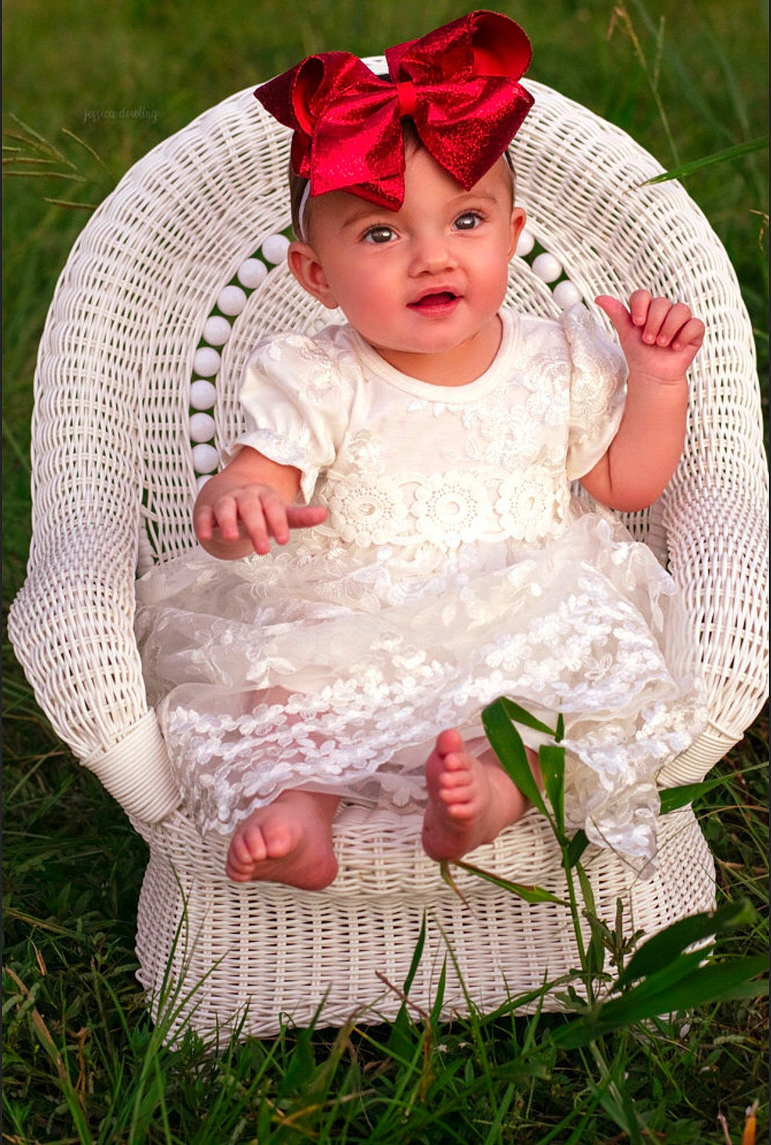 Madalynn is registered to the contest to win money with this photo: baby, baby_products, baby_toddler_clothing, basket, bonnet, child, costume, dress, grass, hair_accessory, headgear, person, photo_shoot, pink, plant, product, red, sitting, skin, toddler