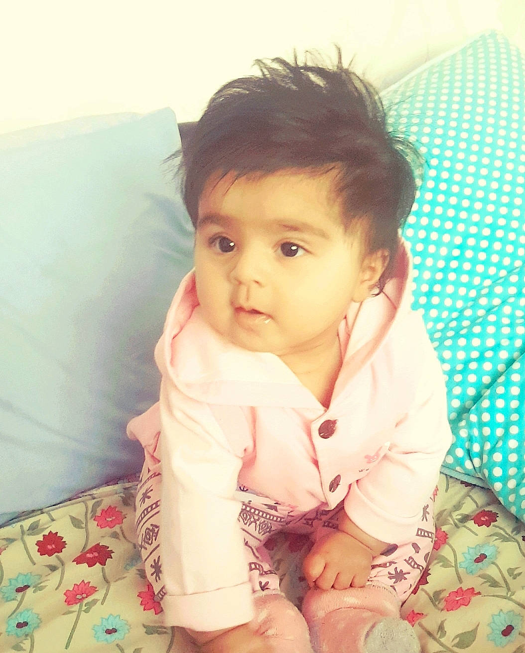 Anaya joined the competition — help win amazing prizes! baby, baby_toddler_clothing, bedding, cheek, child, comfort, couch, eye, happy, iris, linens, lip, nose, pattern, person, pillow, room, sitting, skin, sleeve