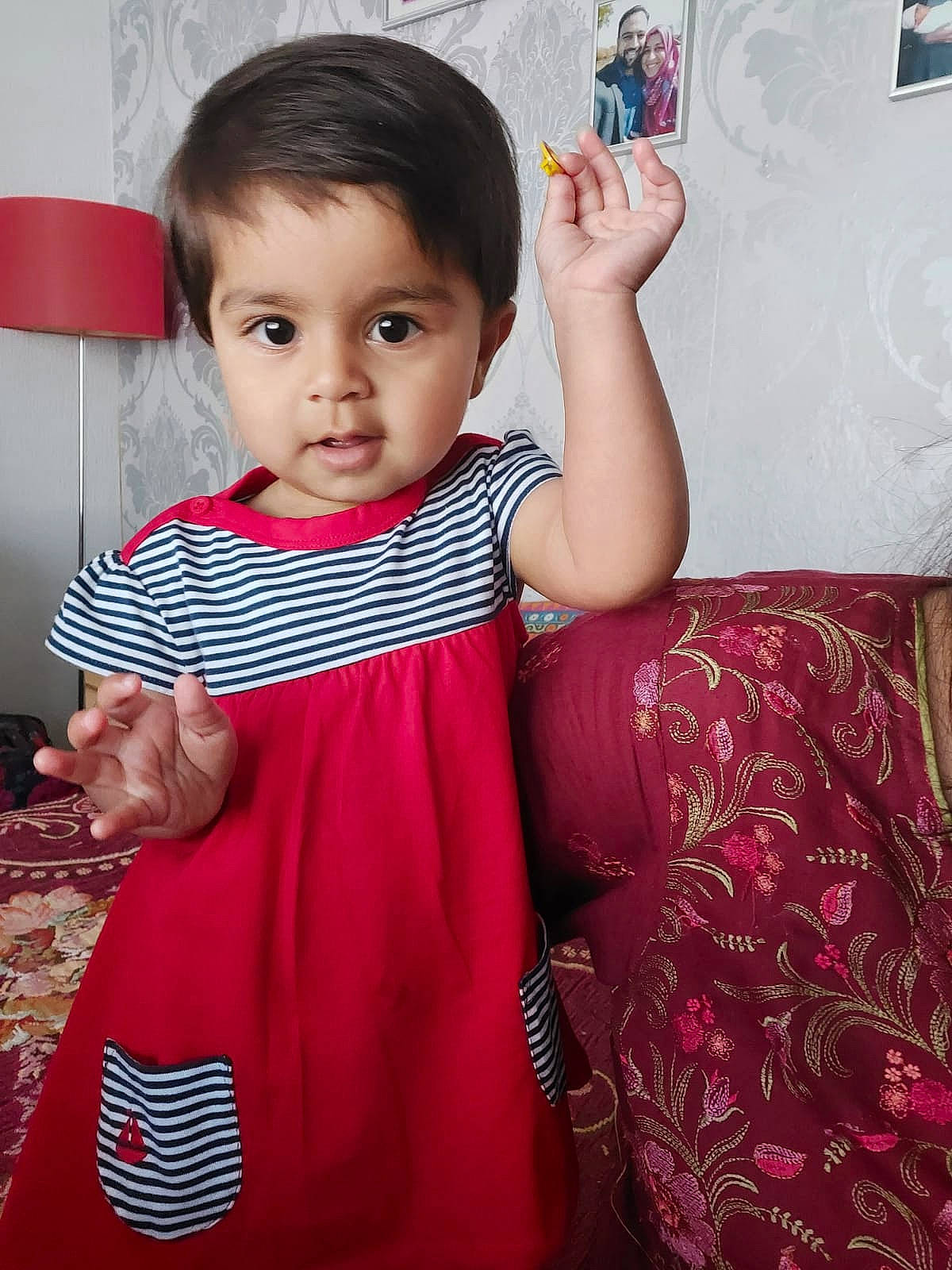 Anaya joined the competition — help win amazing prizes! baby, baby_toddler_clothing, cheek, dress, face, finger, gesture, hairstyle, hand, happy, human_body, joint, neck, one_piece_garment, person, pink, purple, shoulder, skin, sleeve