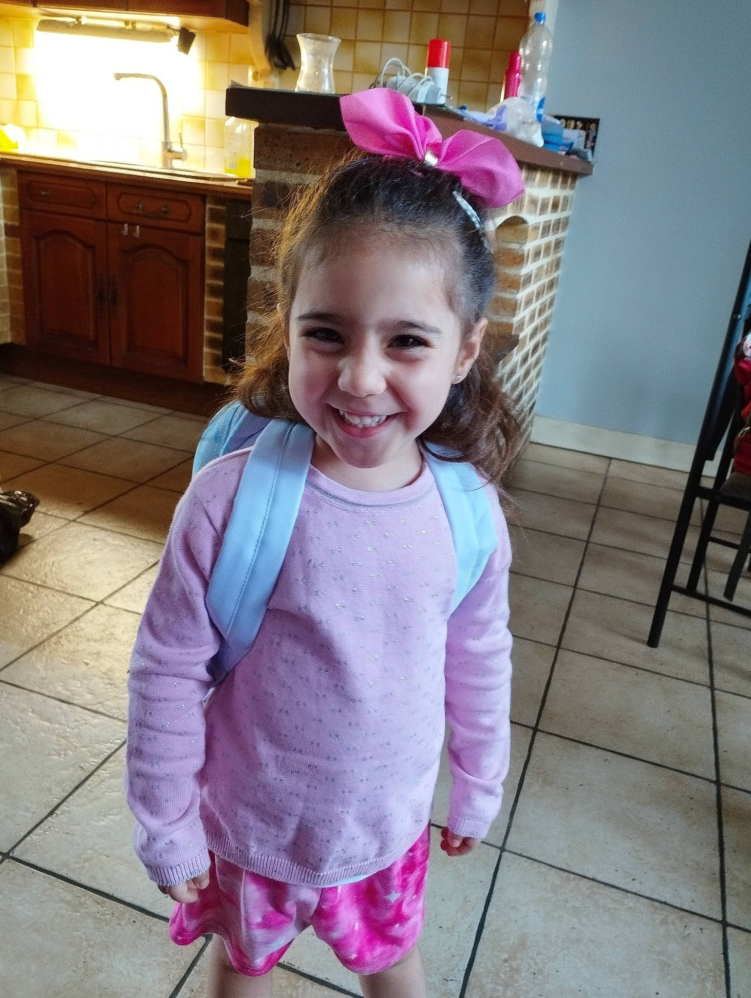 Zoélie a rejoint le concours — aidez-le/la à gagner de superbes lots ! baby_toddler_clothing, cabinetry, child, drawer, flooring, fun, hair, happy, head, joy, kitchen_appliance, long_hair, magenta, person, pink, purple, room, sitting, sleeve, smile