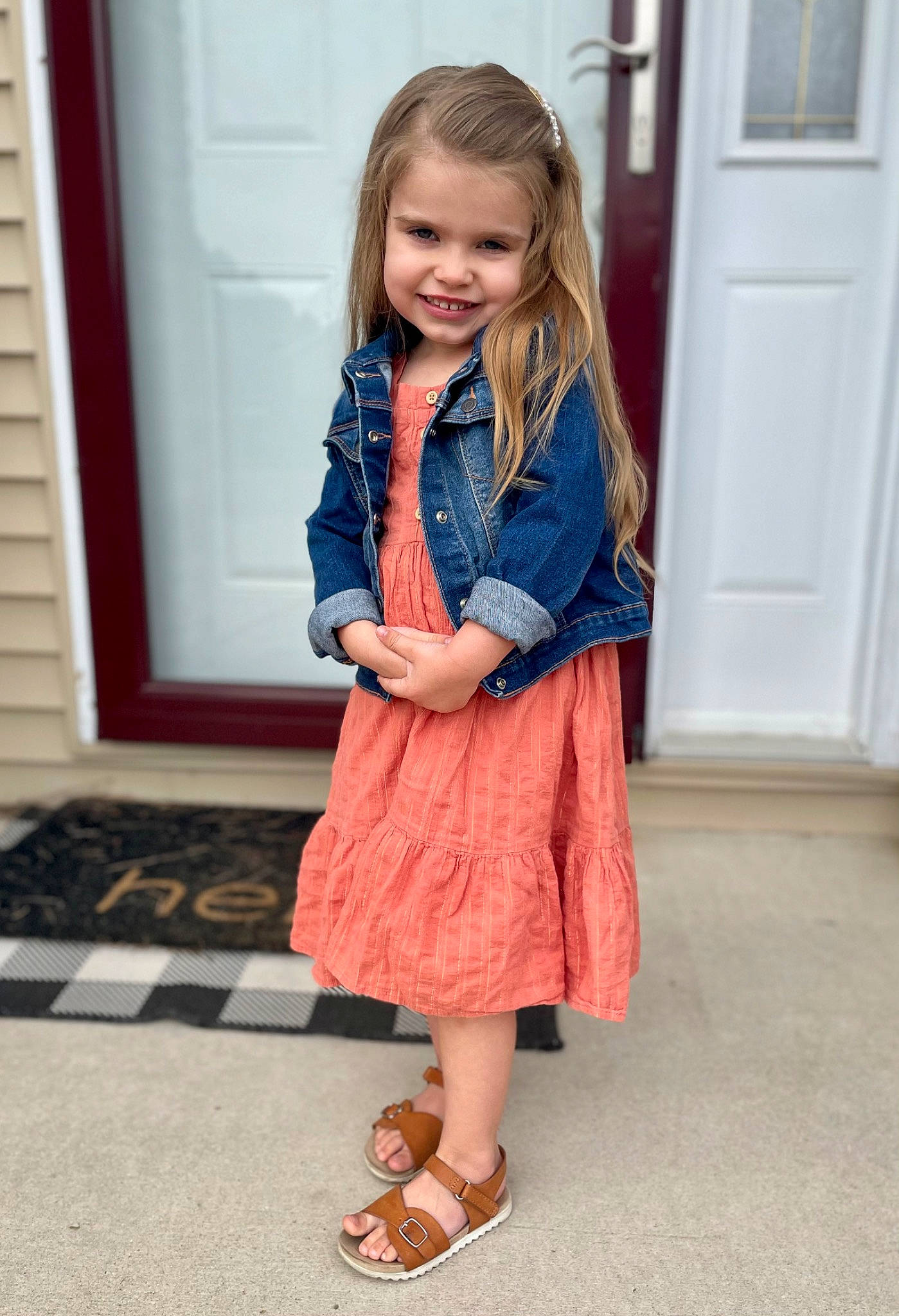 Harper joined the competition — help win amazing prizes! baby_toddler_clothing, day_dress, door, dress, facial_expression, fawn, floor, flooring, footwear, hair, joy, knee, leg, neck, one_piece_garment, outerwear, person, sleeve, smile, standing