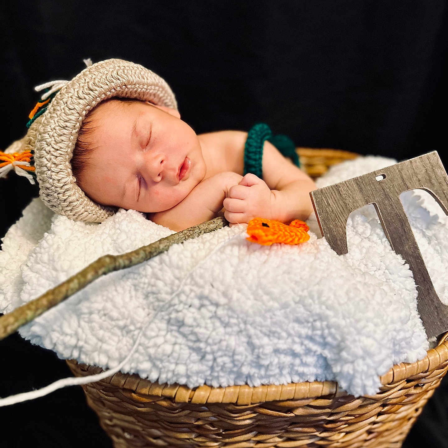 Tristan joined the competition — help win amazing prizes! baby, basket, beanie, bed, blanket, bonnet, cap, clothing, face, furniture, glove, hat, head, newborn, person, photography, portrait, quilt, sleeping, towel